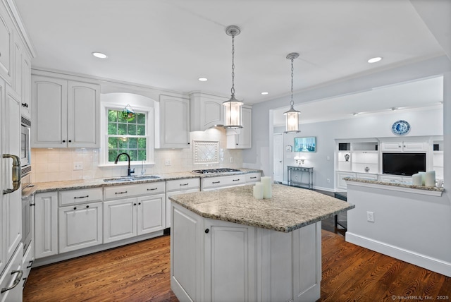 3 Colonial Dr, Clinton, CT 06413 - kitchen featuring stainless steel gas cooktop, white cabinetry, a kitchen island, light stone countertops, and recessed lighting