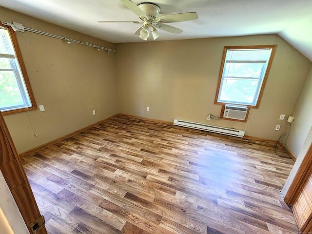 148 Millbrook Rd, Meriden, CT 06450 - unfurnished room featuring a baseboard heating unit, wood finished floors, ceiling fan, a wall unit AC, and lofted ceiling