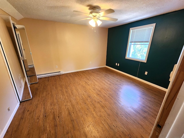 148 Millbrook Rd, Meriden, CT 06450 - empty room featuring baseboard heating, a textured ceiling, ceiling fan, wood finished floors, and baseboards