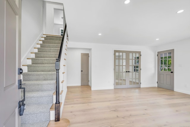 189 Tashua Rd, Trumbull, CT 06611 - entrance foyer featuring french doors, recessed lighting, light wood-type flooring, and stairway