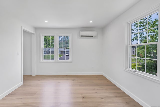 189 Tashua Rd, Trumbull, CT 06611 - spare room with plenty of natural light, a wall mounted air conditioner, light wood finished floors, and recessed lighting