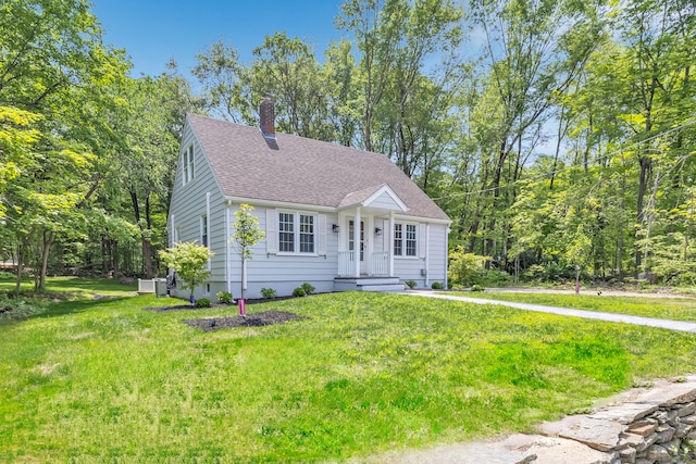 189 Tashua Rd, Trumbull, CT 06611 - new england style home featuring a chimney, roof with shingles, and a front lawn