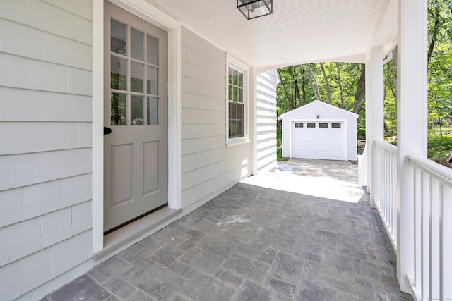 189 Tashua Rd, Trumbull, CT 06611 - porch with an outdoor structure, a garage, and driveway