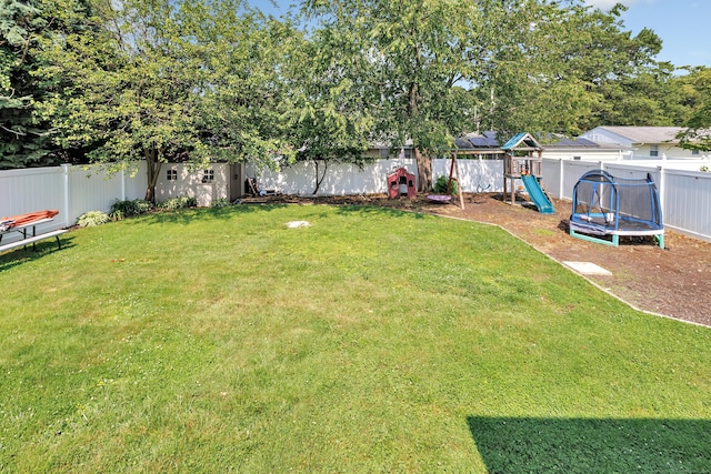 55 Osborne St, Stratford, CT 06614 - fenced backyard with a trampoline and a playground