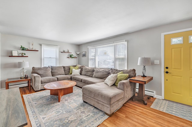 55 Osborne St, Stratford, CT 06614 - living room with light wood-style floors and baseboard heating