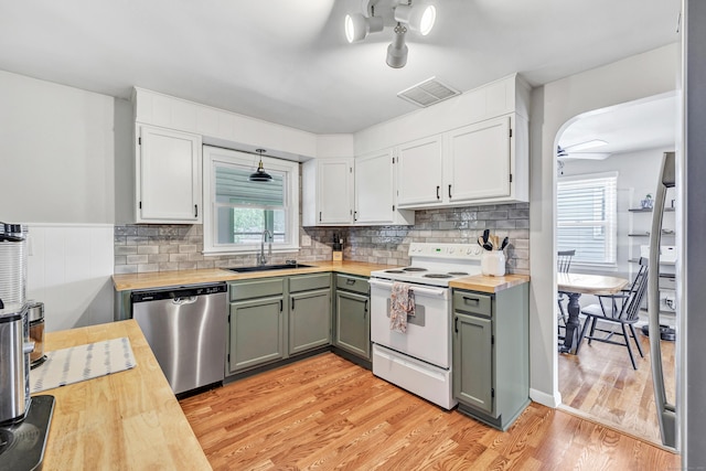 55 Osborne St, Stratford, CT 06614 - kitchen featuring dishwasher, white range with electric cooktop, butcher block counters, light wood finished floors, and healthy amount of natural light