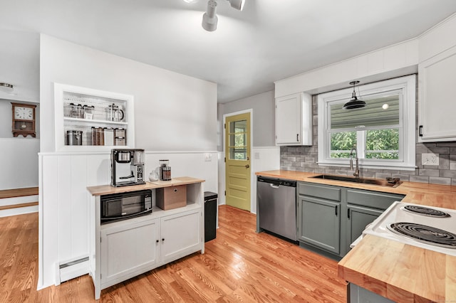 55 Osborne St, Stratford, CT 06614 - kitchen featuring dishwasher, black microwave, light wood finished floors, butcher block countertops, and tasteful backsplash