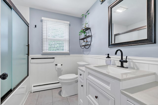 55 Osborne St, Stratford, CT 06614 - full bath featuring a baseboard heating unit, a wainscoted wall, vanity, tile patterned floors, and bath / shower combo with glass door