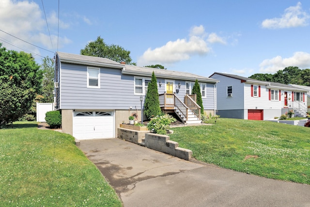 55 Osborne St, Stratford, CT 06614 - view of front of house with a front yard, driveway, and an attached garage