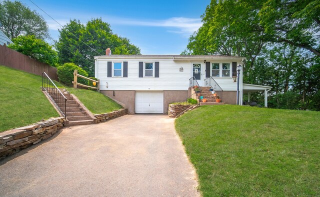 1 Trumbull St, Vernon, CT 06066 - view of front of property featuring asphalt driveway, an attached garage, a chimney, and stairway