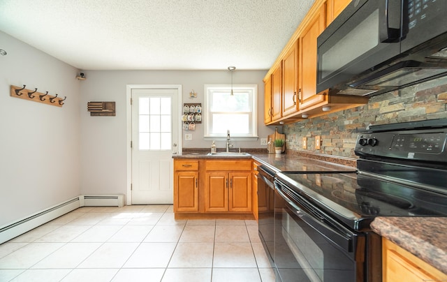 1 Trumbull St, Vernon, CT 06066 - kitchen with black appliances, a sink, dark countertops, hanging light fixtures, and a textured ceiling