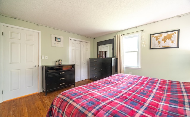 1 Trumbull St, Vernon, CT 06066 - bedroom with dark wood-style flooring, a textured ceiling, and a closet