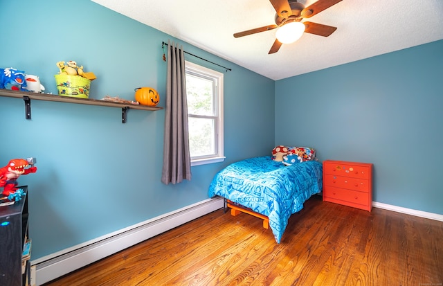 1 Trumbull St, Vernon, CT 06066 - bedroom with a baseboard heating unit, wood finished floors, baseboards, and ceiling fan