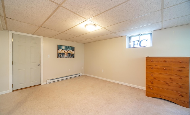 1 Trumbull St, Vernon, CT 06066 - basement featuring a baseboard heating unit, a paneled ceiling, light carpet, and baseboards