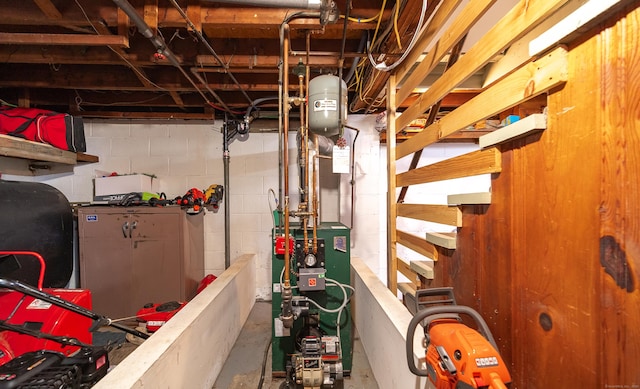 1 Trumbull St, Vernon, CT 06066 - unfinished basement with a heating unit, stairway, and oil tank