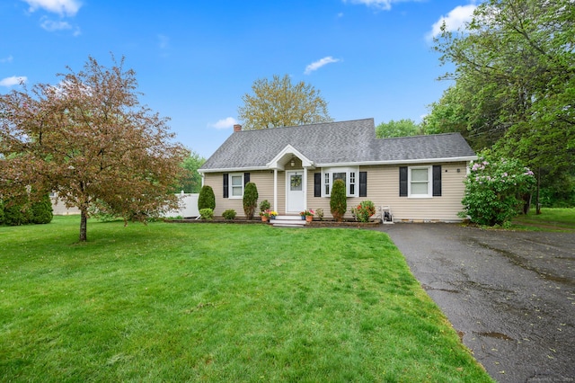 21 Sorrento Rd, Wallingford, CT 06492 - view of front of home featuring a chimney, a front yard, and driveway