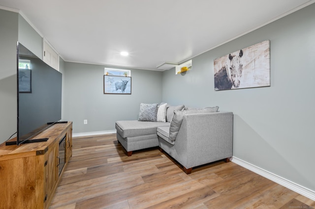 21 Sorrento Rd, Wallingford, CT 06492 - living area featuring baseboards, light wood-style floors, recessed lighting, crown molding, and plenty of natural light