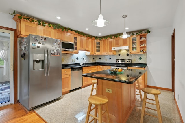 41 Alpine Rd, Monroe, CT 06468 - kitchen with stainless steel appliances, under cabinet range hood, a breakfast bar, backsplash, and recessed lighting