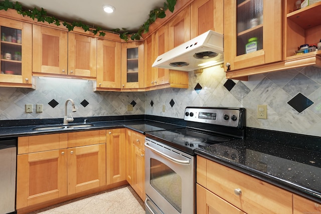 41 Alpine Rd, Monroe, CT 06468 - kitchen with stainless steel appliances, under cabinet range hood, a sink, dark stone counters, and backsplash