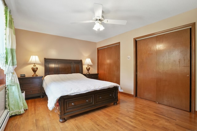 41 Alpine Rd, Monroe, CT 06468 - bedroom featuring multiple closets, a baseboard radiator, light wood-type flooring, and a ceiling fan