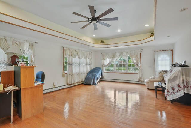 41 Alpine Rd, Monroe, CT 06468 - bedroom with a tray ceiling, wood finished floors, recessed lighting, and a baseboard heating unit