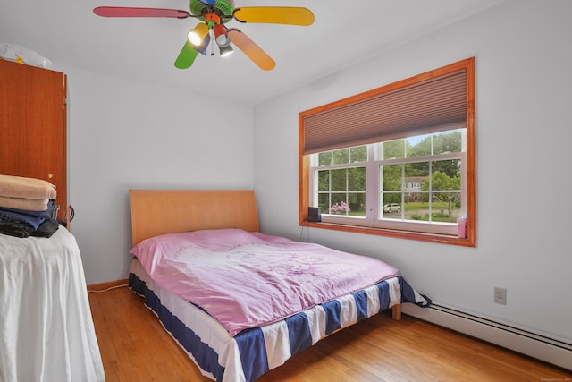 41 Alpine Rd, Monroe, CT 06468 - bedroom featuring a baseboard radiator, wood-type flooring, and ceiling fan