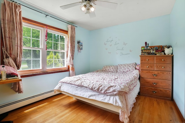 41 Alpine Rd, Monroe, CT 06468 - bedroom featuring baseboard heating, light wood-style flooring, and a ceiling fan
