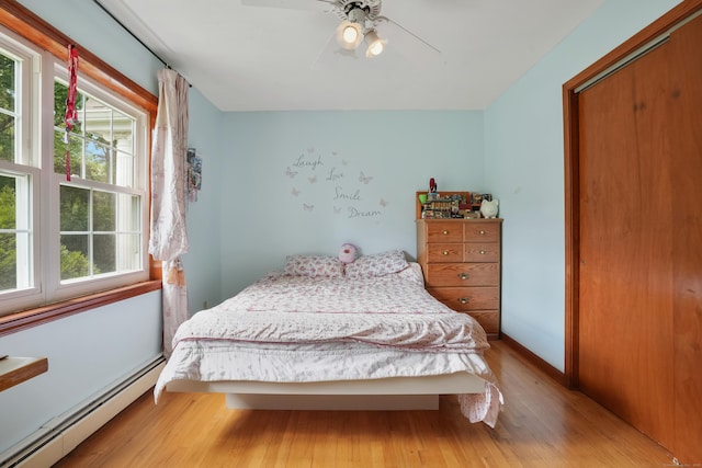41 Alpine Rd, Monroe, CT 06468 - bedroom with baseboard heating, wood finished floors, and a ceiling fan