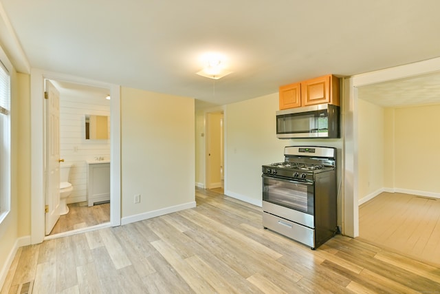 96 Water St, Killingly, CT 06239 - kitchen featuring appliances with stainless steel finishes, light wood-style floors, and baseboards