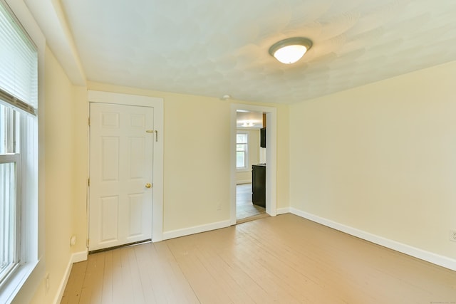 96 Water St, Killingly, CT 06239 - unfurnished bedroom with light wood-style floors and baseboards