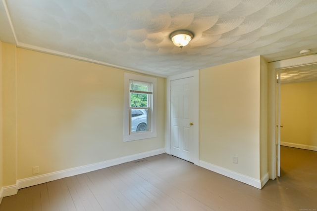 96 Water St, Killingly, CT 06239 - unfurnished room featuring baseboards, wood finished floors, and a smoke detector