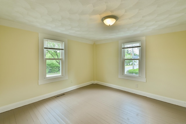 96 Water St, Killingly, CT 06239 - unfurnished room with plenty of natural light, wood-type flooring, and baseboards