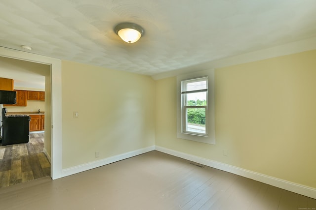 96 Water St, Killingly, CT 06239 - spare room with dark wood-type flooring, baseboards, and a smoke detector