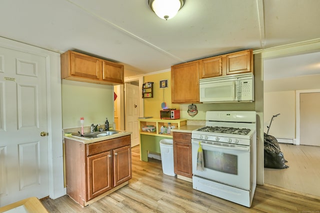 96 Water St, Killingly, CT 06239 - kitchen featuring white appliances, a sink, light countertops, and light wood finished floors