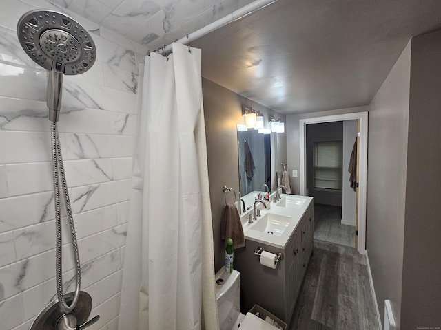 216 Bunker Hill Ave, Waterbury, CT 06708 - full bath with wood finished floors, vanity, toilet, and a shower with curtain