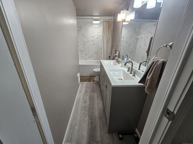 216 Bunker Hill Ave, Waterbury, CT 06708 - bathroom with wood finished floors, double vanity, toilet, and shower / bathtub combination with curtain