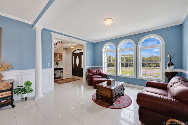 197 Shadow Pond Ln, Suffield, CT 06078 - living room featuring decorative columns, wainscoting, crown molding, and light tile patterned floors