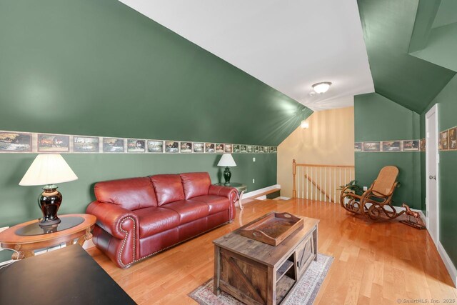 197 Shadow Pond Ln, Suffield, CT 06078 - living area with wood finished floors, lofted ceiling, and baseboards