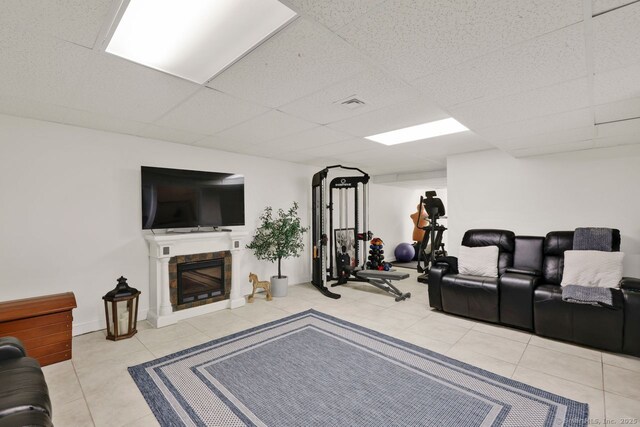 197 Shadow Pond Ln, Suffield, CT 06078 - tiled living area with a paneled ceiling and a fireplace