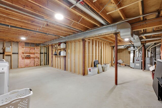 197 Shadow Pond Ln, Suffield, CT 06078 - unfinished below grade area featuring heating unit and washer / dryer