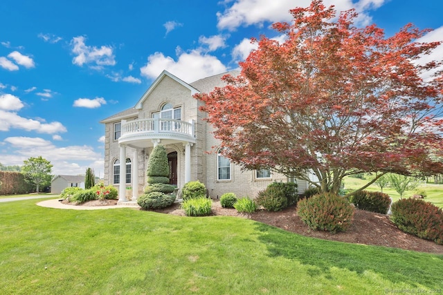 197 Shadow Pond Ln, Suffield, CT 06078 - georgian-style home with a balcony, brick siding, and a front yard