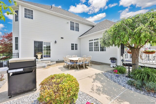 197 Shadow Pond Ln, Suffield, CT 06078 - rear view of house featuring a patio area and roof with shingles