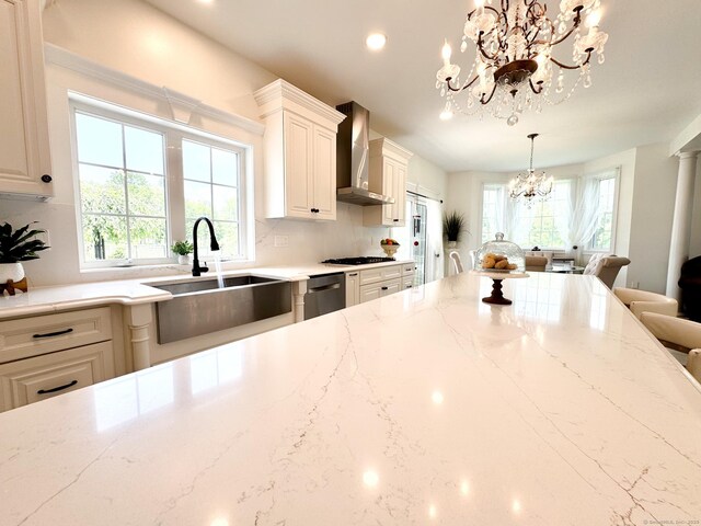 197 Shadow Pond Ln, Suffield, CT 06078 - kitchen with wall chimney exhaust hood, a chandelier, a sink, gas stovetop, and recessed lighting