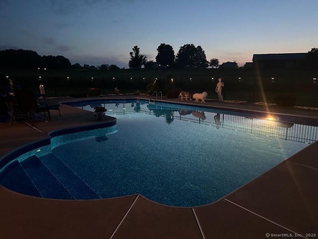 197 Shadow Pond Ln, Suffield, CT 06078 - pool at dusk with an outdoor pool and a patio