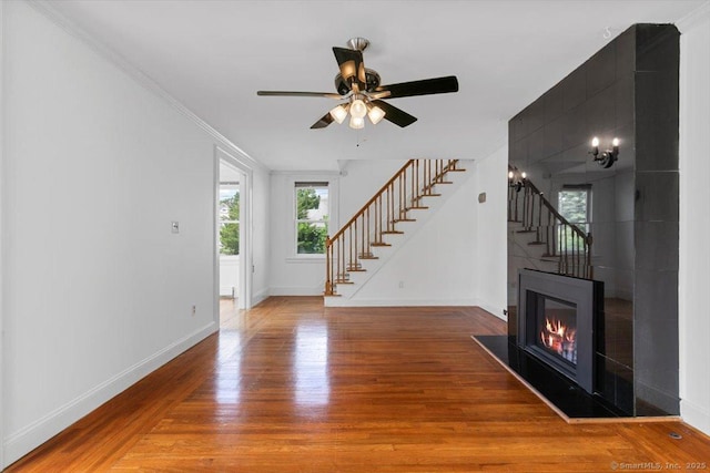 37 Park Ave, Hamden, CT 06517 - unfurnished living room featuring stairs, wood finished floors, baseboards, ceiling fan, and ornamental molding