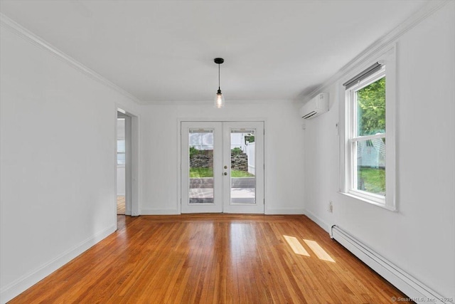 37 Park Ave, Hamden, CT 06517 - unfurnished dining area with baseboard heating, an AC wall unit, light wood-style flooring, french doors, and baseboards