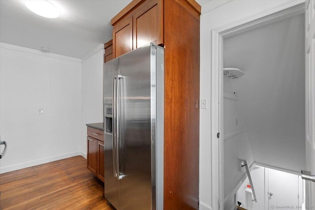 37 Park Ave, Hamden, CT 06517 - kitchen with stainless steel fridge, brown cabinets, dark wood-style flooring, dark countertops, and baseboards