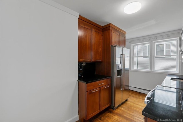 37 Park Ave, Hamden, CT 06517 - kitchen featuring stainless steel refrigerator with ice dispenser, light wood-type flooring, dark countertops, baseboard heating, and baseboards