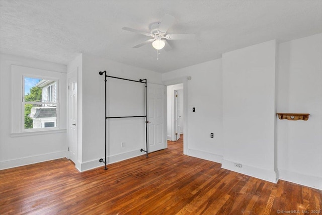 37 Park Ave, Hamden, CT 06517 - unfurnished bedroom featuring wood finished floors, baseboards, and a ceiling fan