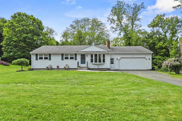 63 Paul Ter, Southington, CT 06489 - view of front facade featuring a garage, a chimney, asphalt driveway, and a front yard